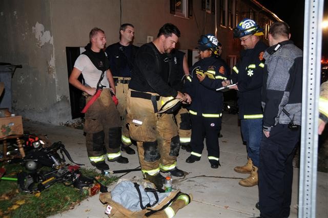 Captain Bill Gray, Firefighters Bill Hensel and Bill Hirthler getting rehabbed by the EMS crew of Linda Dutton and Alan Kennedy.